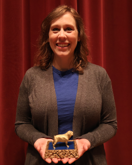 Lynn Kassel holding the faculty Morrow award